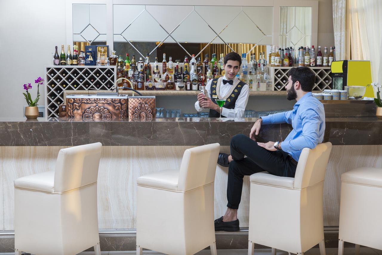 Gabala Garden Hotel Exterior photo A bartender at work