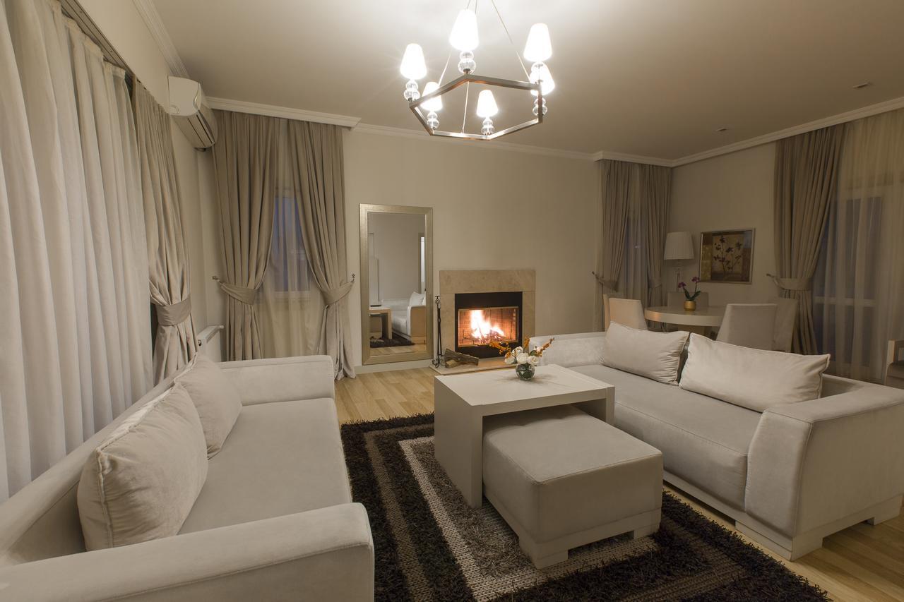 Gabala Garden Hotel Exterior photo A living room with a fireplace