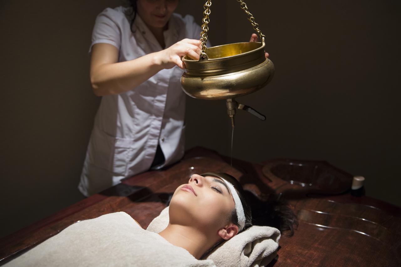 Gabala Garden Hotel Exterior photo A woman receiving a head massage